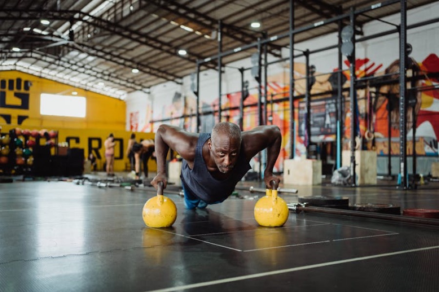 Sports woman doing push ups in fitness gym